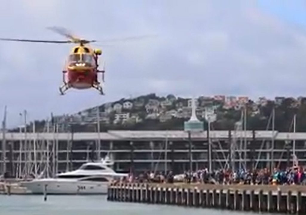 Westpac Life Flight rescue helicopter demonstrating winching someone from a boat in Wellington Harbour 